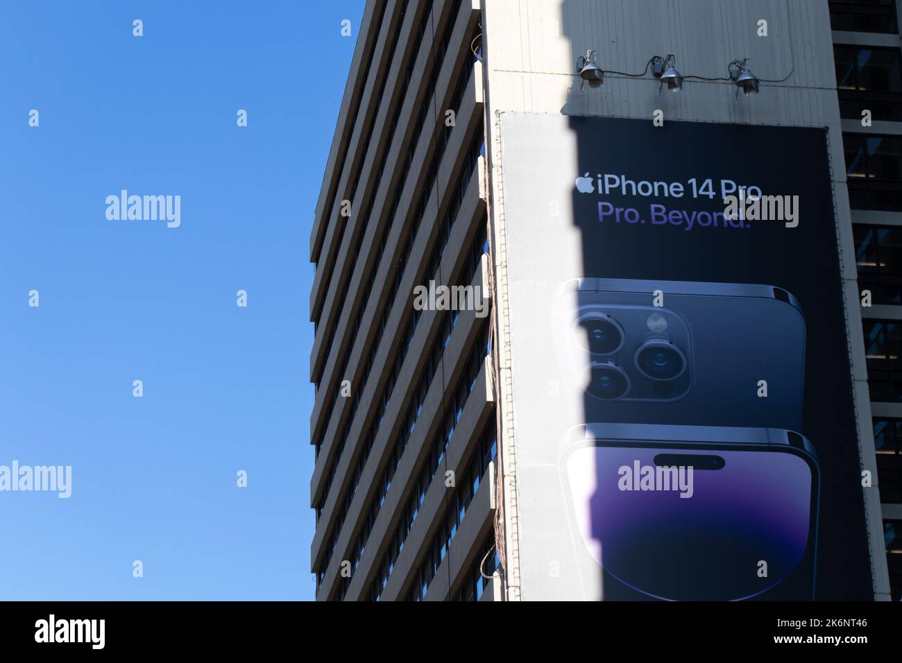 An advertisement billboard for the latest Apple iPhone, the iPhone 14 Pro, is seen on the side of a building in Toronto. Stock Photo