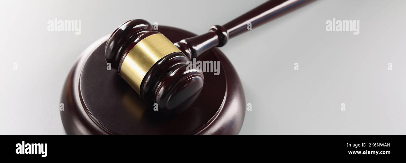 Red judge's gavel on a gray background Stock Photo Alamy