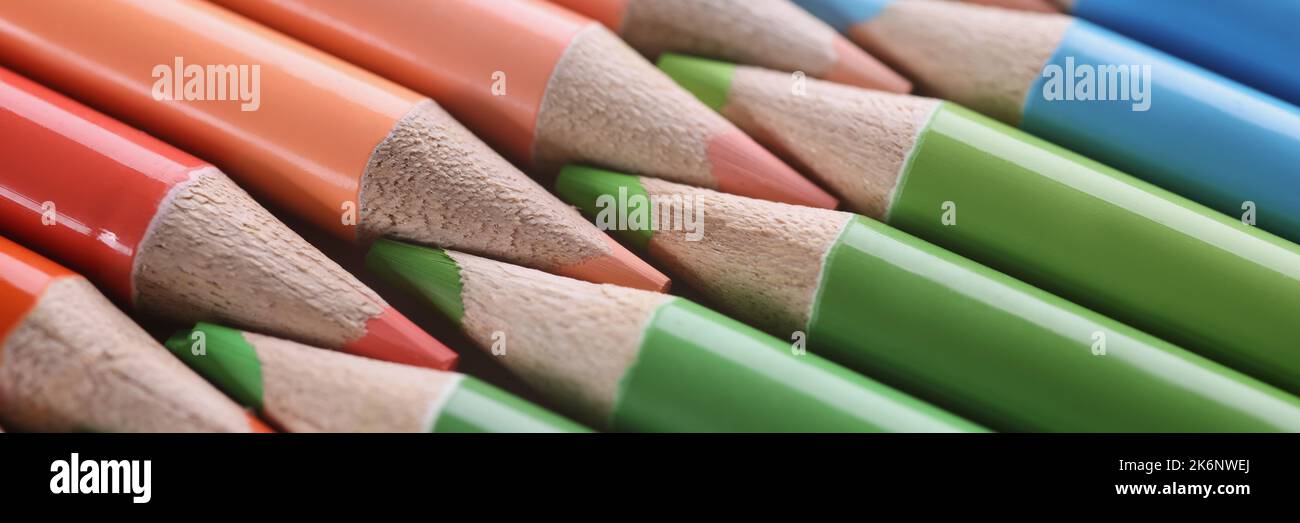 Macro sharpened red green blue pencils, blurry Stock Photo