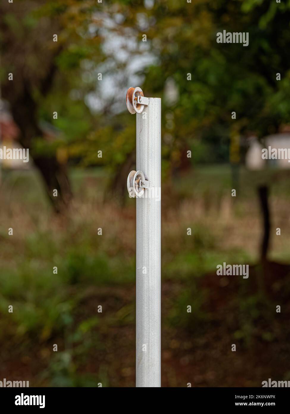 pulley on a metal pole to extend net on volleyball court Stock Photo