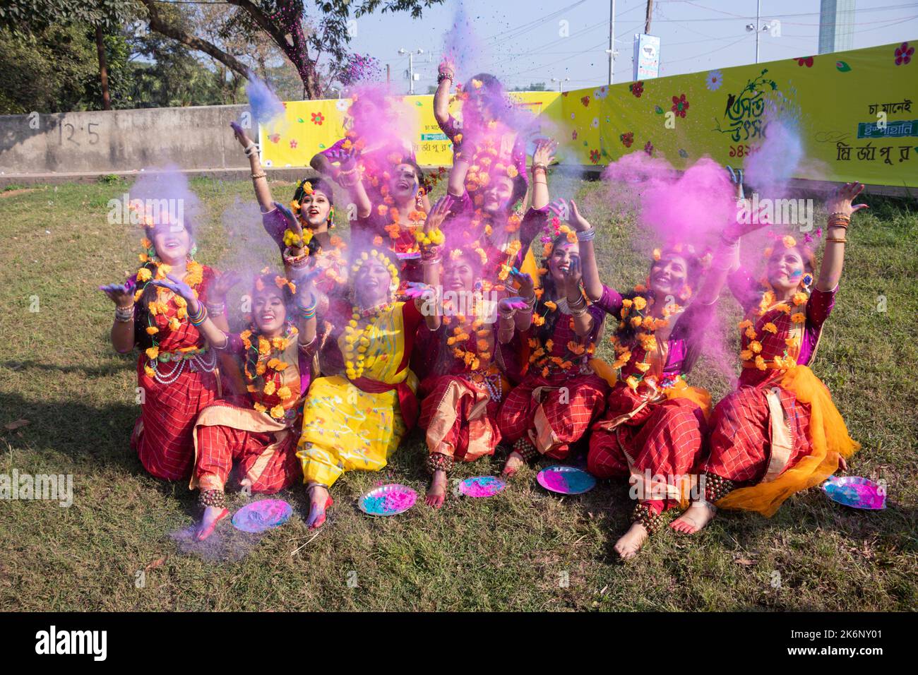 Women wear traditional dresses with floral ornaments and perform during Spring Festival, the