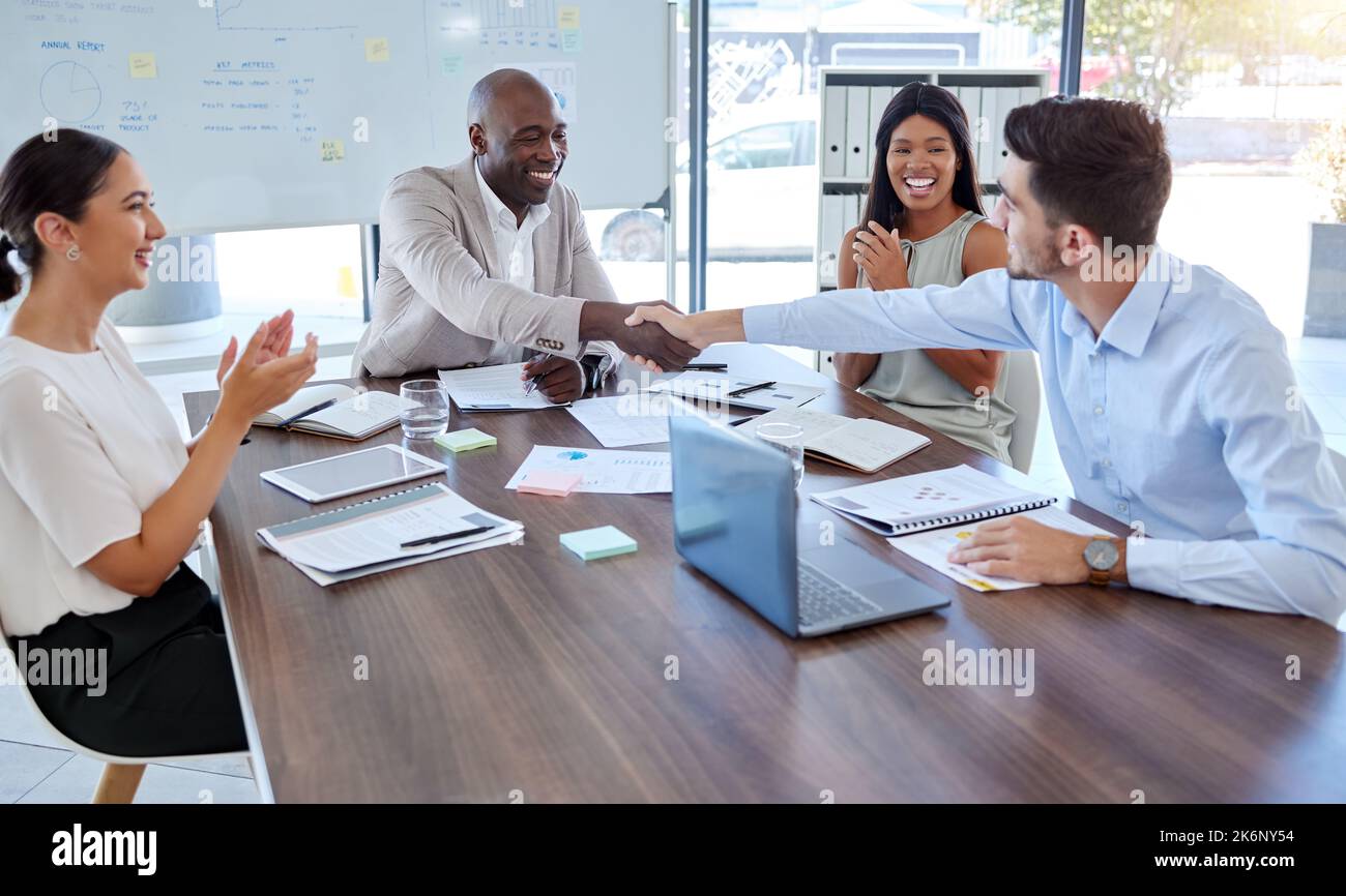 Handshake, partnership or promotion success in office support, trust deal or crm in b2b digital marketing collaboration meeting. Smile, happy and Stock Photo