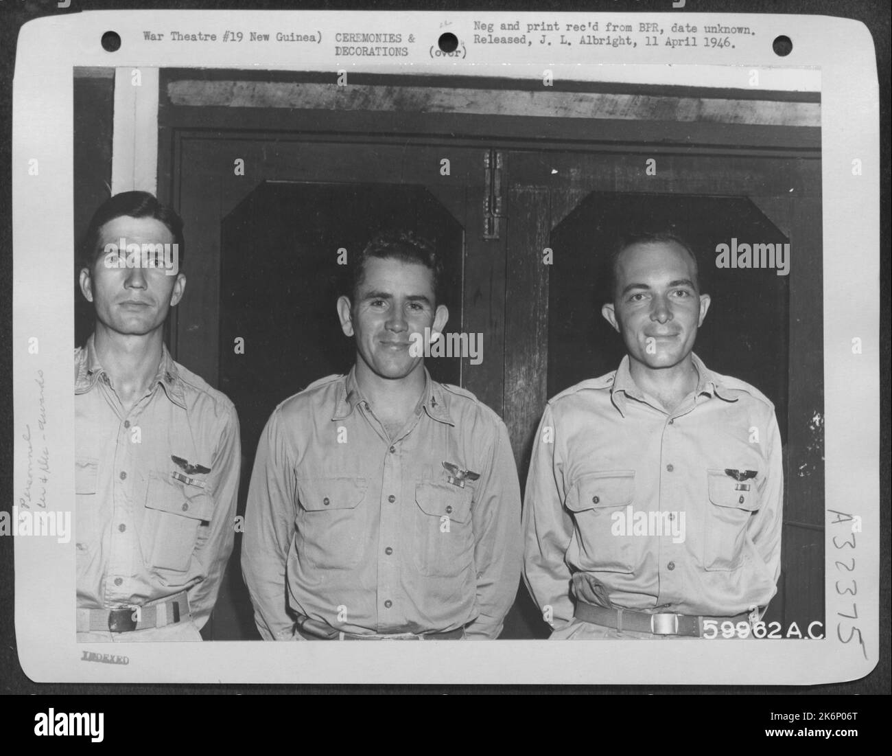 The Air Medal was awarded these pursuit pilots at ceremonies in New Guinea, for participating in 25 or more combat missions where enemy action was probable and expected. Shown (left to right) are: 2nd Lt. Roy A. Owen, of Greenwood, S.C.; 2nd Lt. Stock Photo