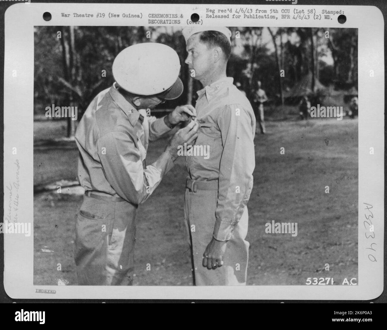 General Ennis C. Whitehead pinning Distinguished Service Medal on Col