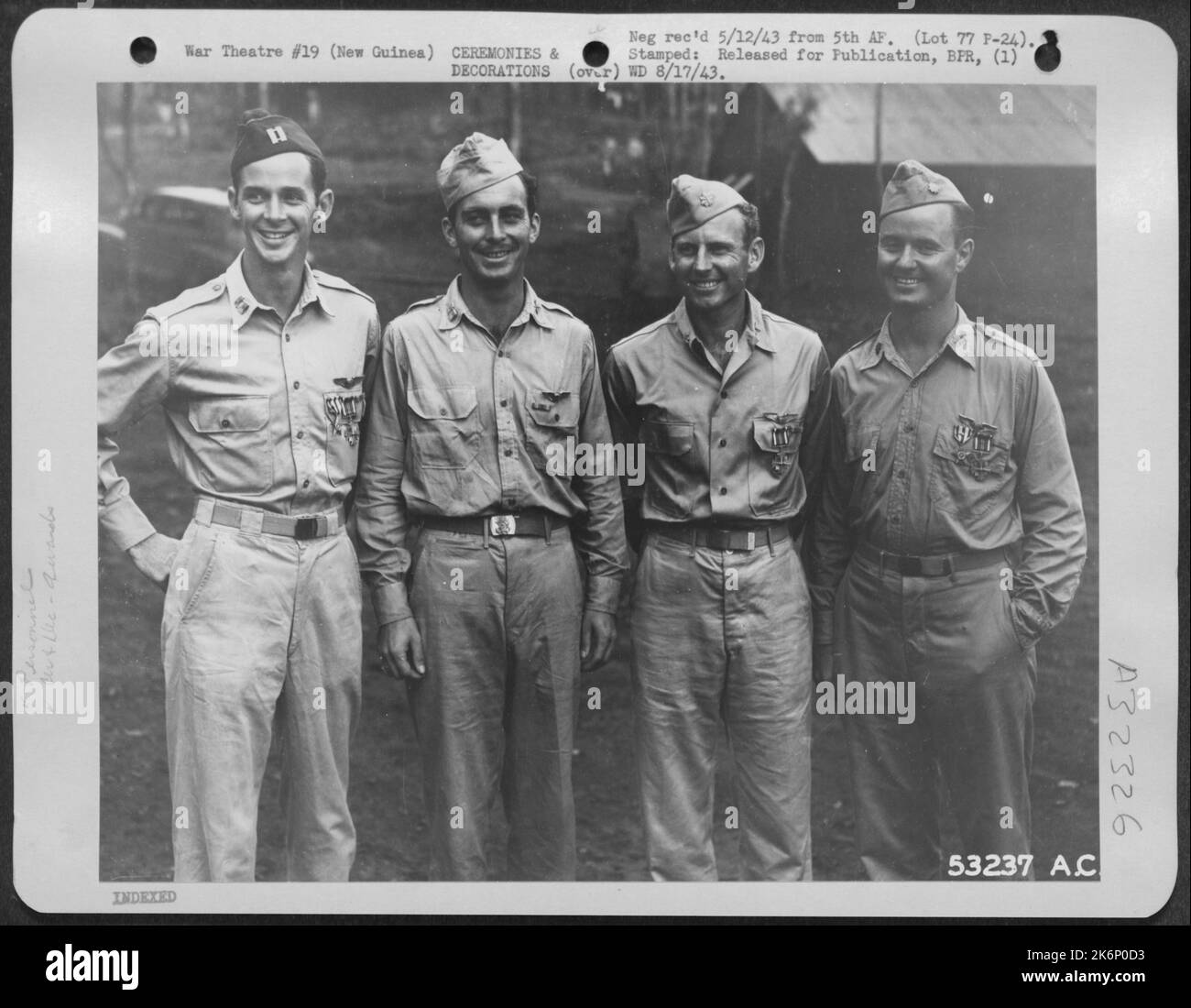 These four pursuit pilots were among 16 officers recently decorated in New Guinea by Lt. General George C. Kenney on the eve of their departure for assignments in the United States. They are (left to right): Capt. Curran L. Jones (Silver Star, Air Stock Photo
