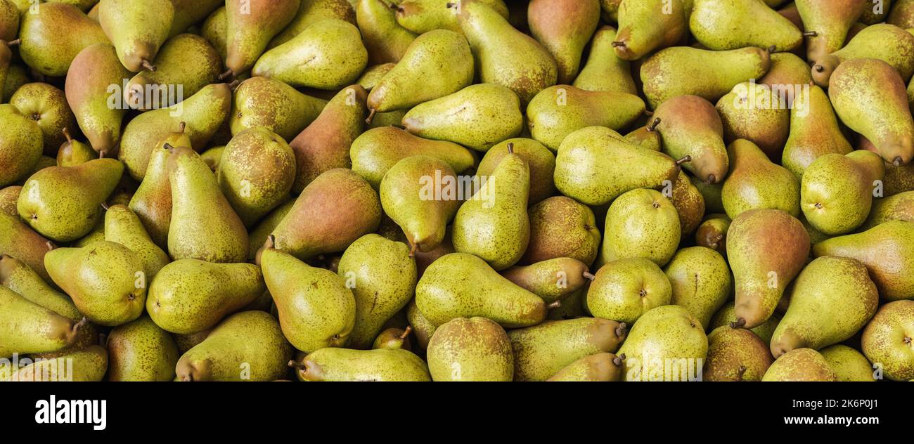 Big pile of Pears on marke, vegan food Stock Photo