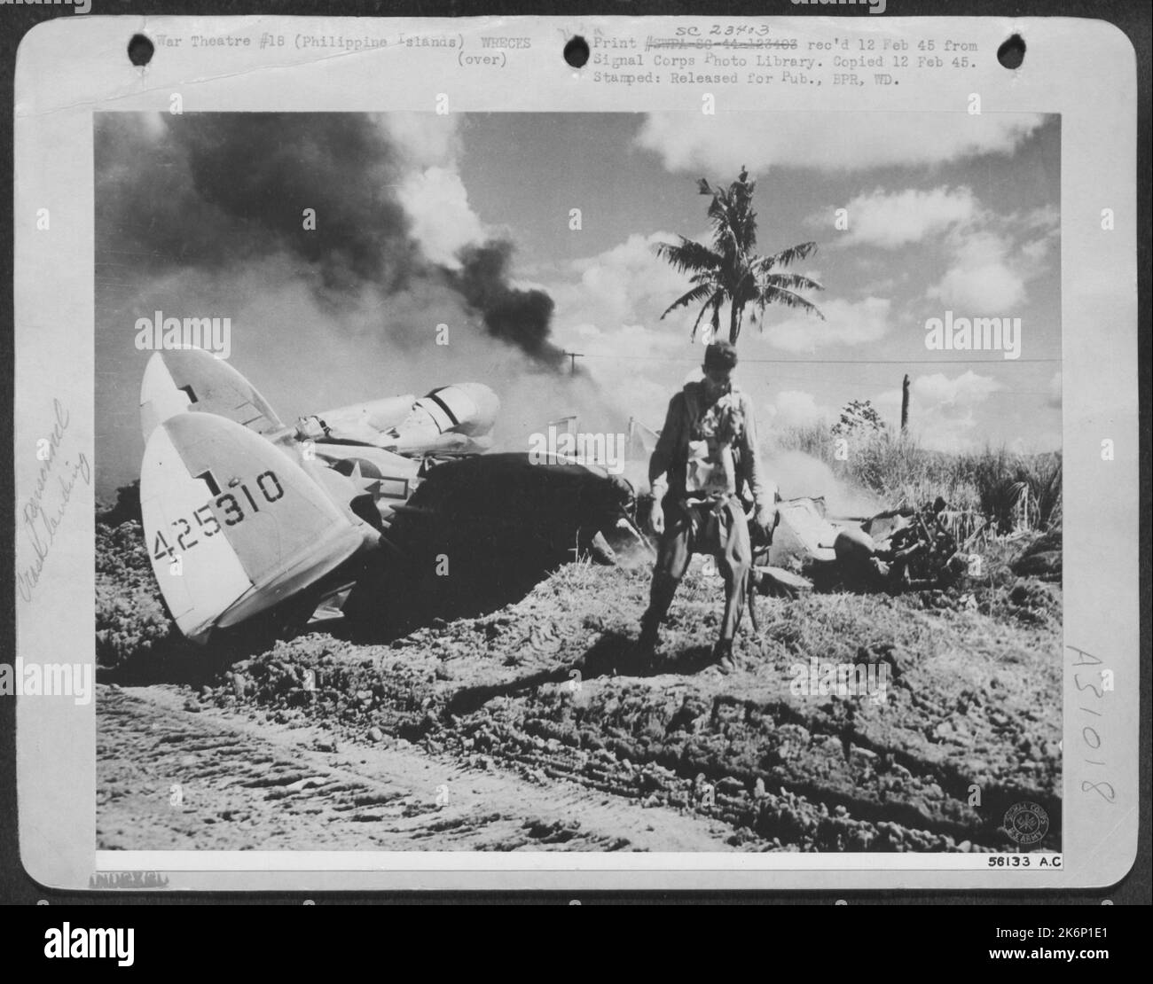 MIRACULOUS ESCAPE--A dramatic picture of Lt. S.F. Ford, fighter-pilot from Baltimore, Maryland, walking from his Lockheed P-38 Lightning unharmed a few seconds after he crash landed. He was shot down in flames by a Jap Zero over Mindoro Island Stock Photo