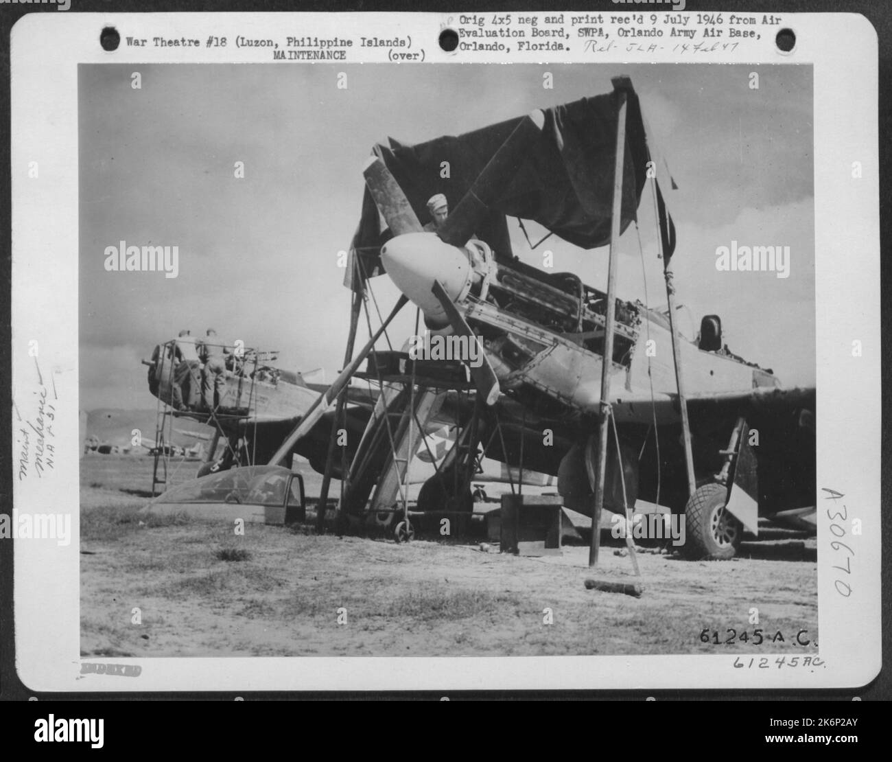 Under the makeshift canopy set up to protect him from the blazing sun