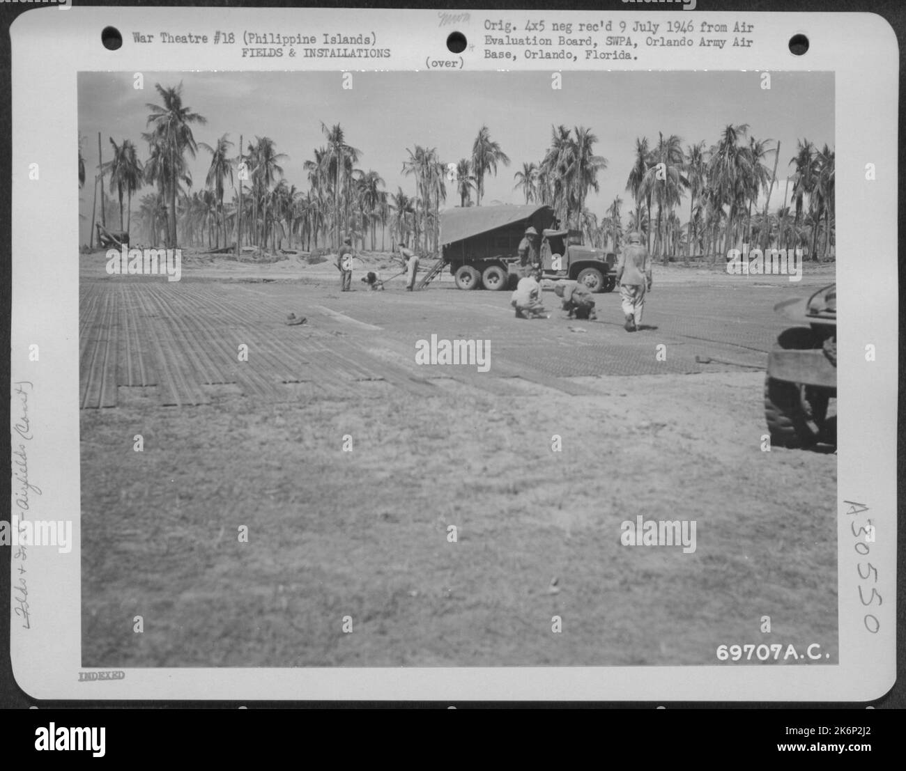 American GI's add the finishing touches to the landing strip under