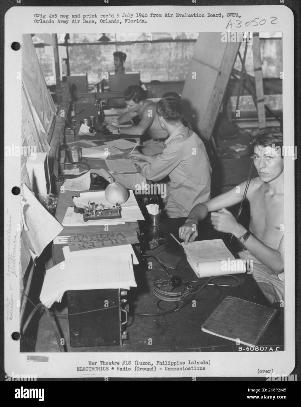 Movements Section of the 45th Fighter Control Center, Luzon, Philippine Islands. This section review all flight plans, having direct contact with local base operations, and receiving all take-off and landings. Thru coninuous wave contact with other Stock Photo