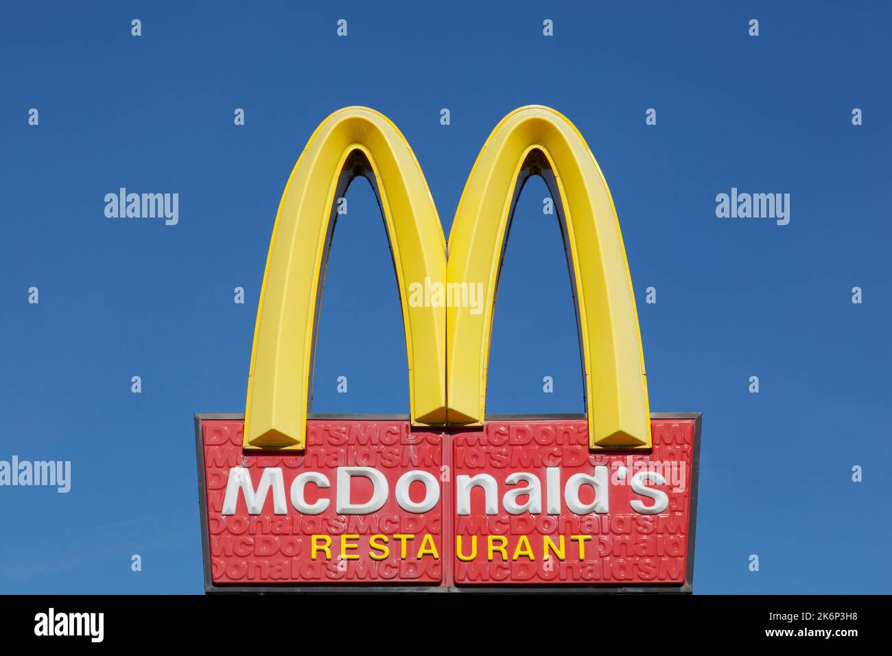 Horsens, Denmark - August 9, 2015: McDonald's logo on a pole. McDonald's is the world's largest chain of hamburger fast food restaurants Stock Photo