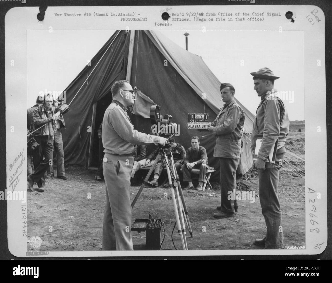 The Alaska Unit'S Motion Picture Cameraman Lt. Reynold Scott Behind The Camera Slating The Next Scene For The Army Pictorial Service. Photo Taken On The Airfield In Umnak. Stock Photo