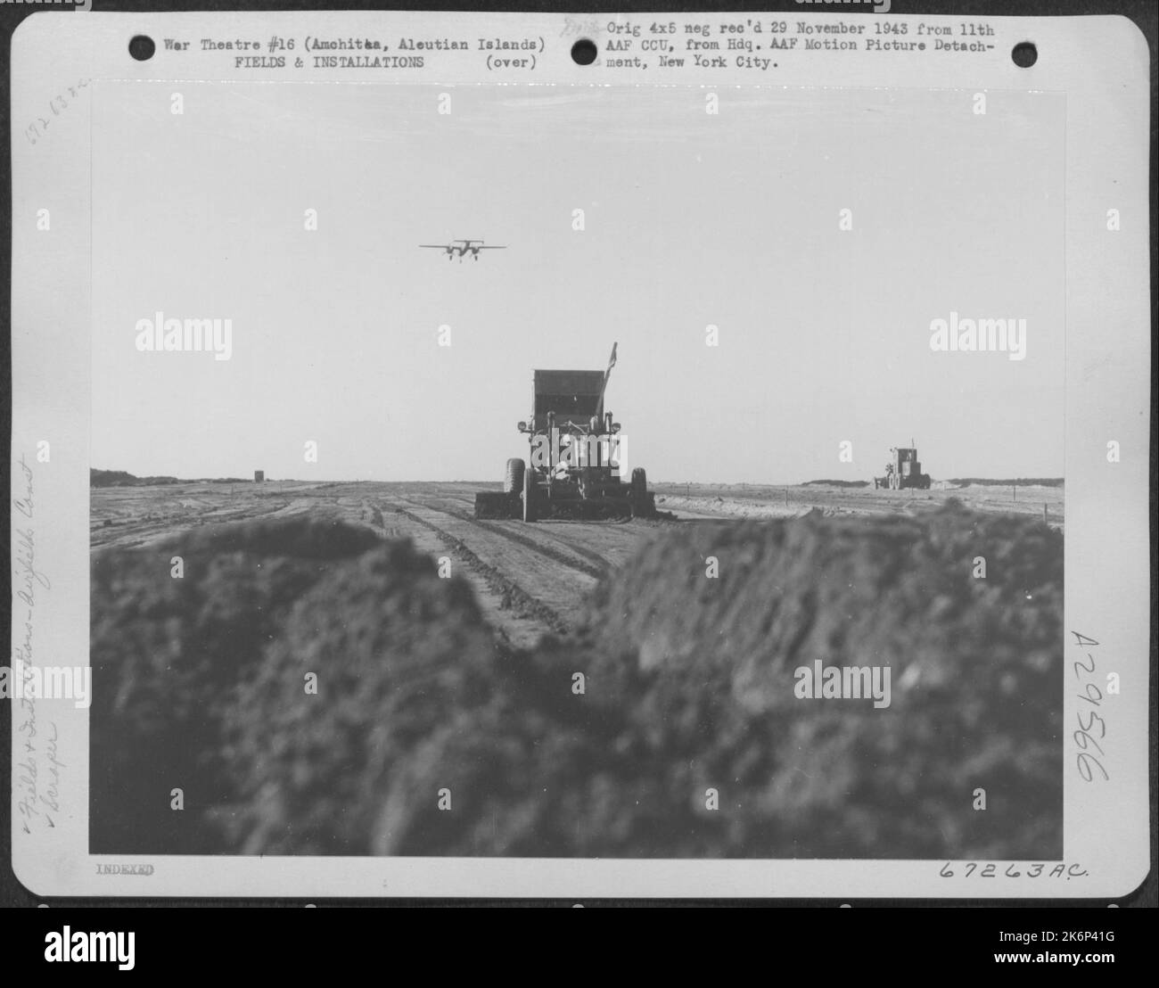 In Preparation For Extending A Bomber Strip, A Scraper Levels Off