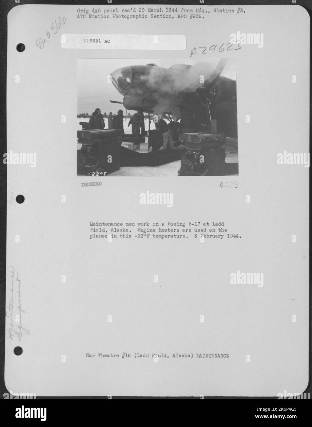 Maintenance men work on a Boeing B17 at Ladd Field, Alaska. Engine