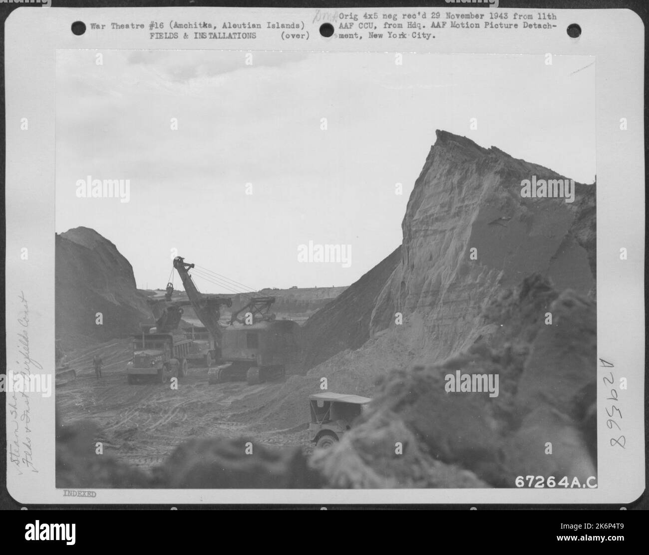 In preparation for enlarging a fighter strip at an 11th Air Force base near Amchitka, Aleutian Islands, a steam shovel is used for the excavation. 12 October 1943. Stock Photo