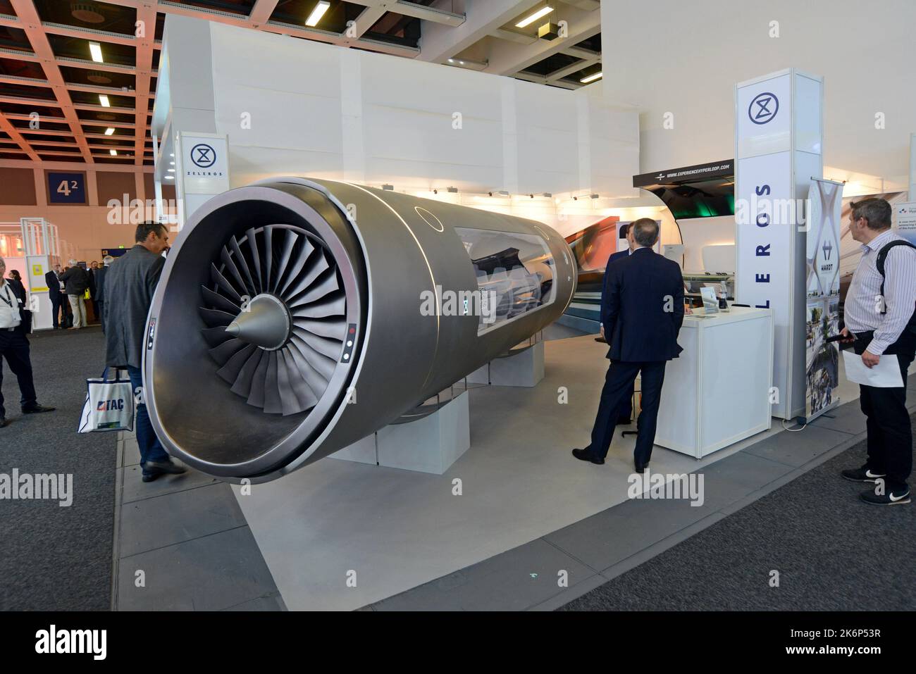 People examining the mock up model of a Zeleros Hyperloop concept ...