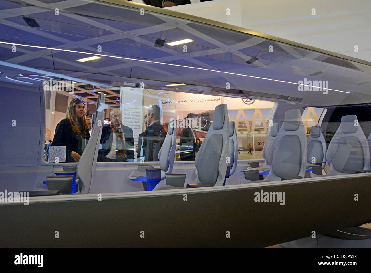People examining the mock up model of a Zeleros Hyperloop concept ...