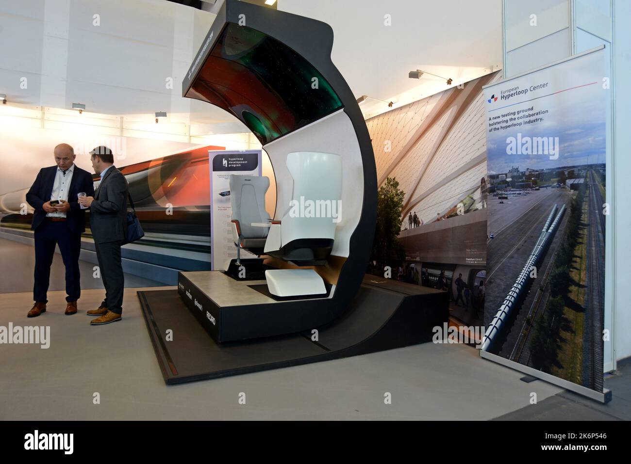 People examining the mock up model of a Zeleros Hyperloop concept ...