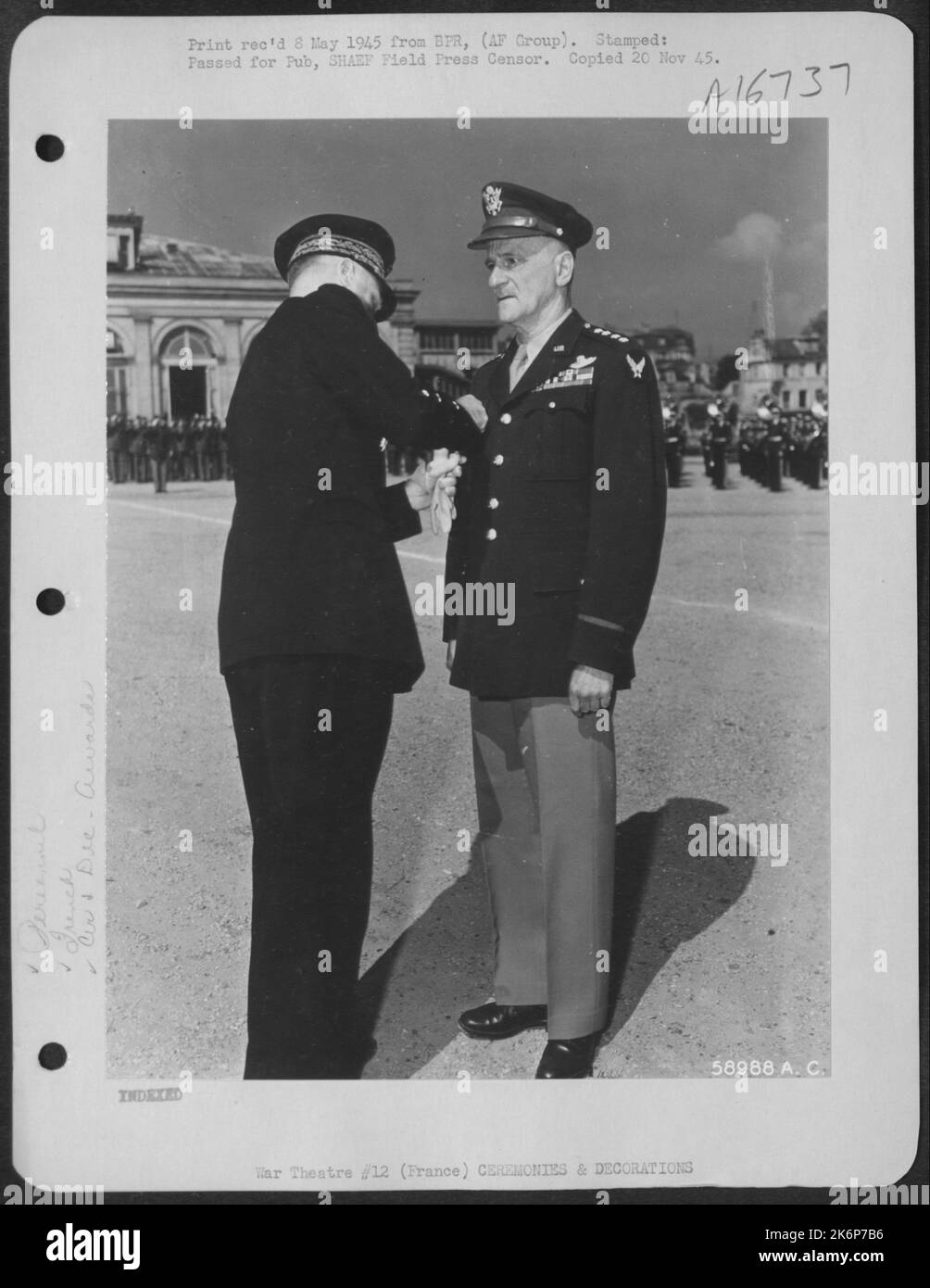 General Carl Spaatz, Commanding U.S. Strategic Air Forces In Europe, Receives The Legion Of Merit (Grand Officer Rank) France'S 2Nd Highest Military Award From Gen. Rene Bouscat, General Inspector Of Operational Units Of The French Army, During A Colorful Stock Photo