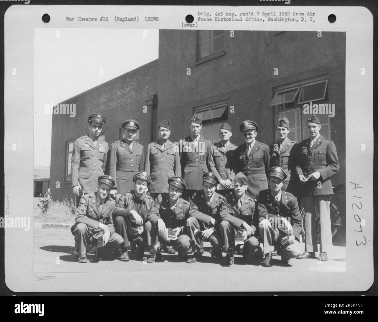 Crew Members Pose Beside A Consolidated B24 Somewhere In England Stock