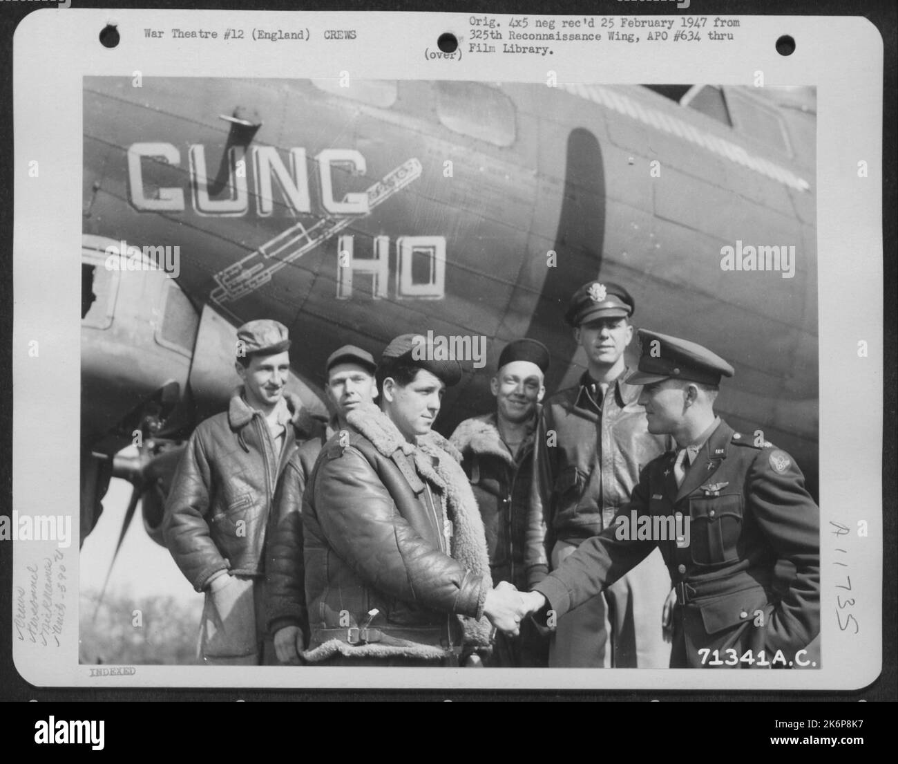 Major Cole Shakes Hands With A Member Of His Ground Crew As They Stand Beside Their Boeing B17