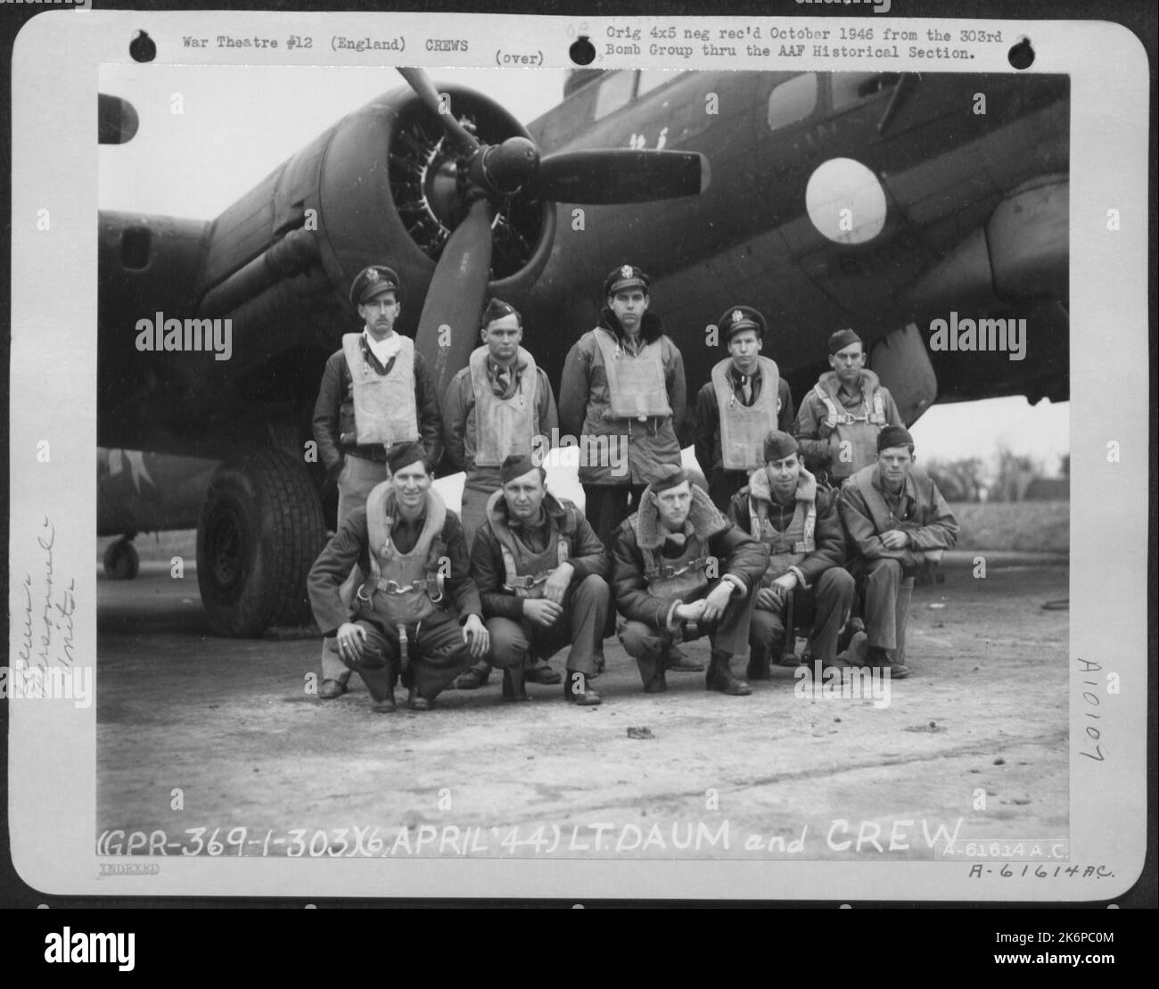Lt. Daum And Crew Of The 359Th Bomb Squadron, 303Rd Bomb Group Based In England, Pose In Front Of A Boeing B-17 Flying Fortress. 6 April 1944. Name Appears To Be 'Thunderbird' Nose Art Is Incomplete. Stock Photo