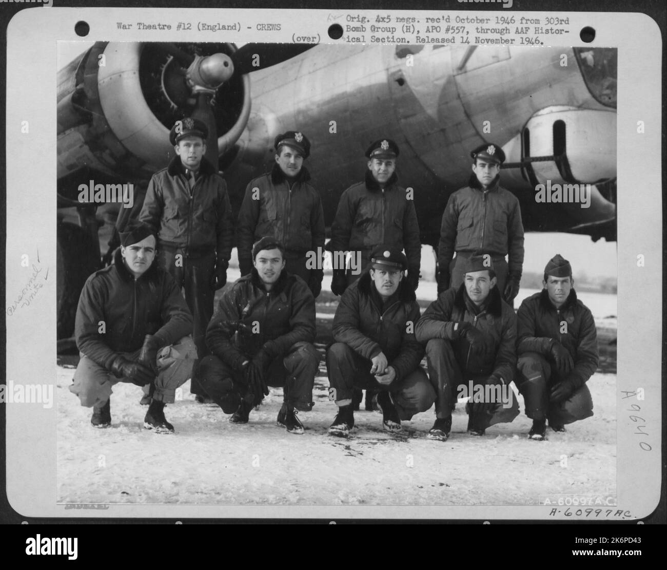 Lt. Austin And Crew Of The 360Th Bomb Squadron, 303Rd Bomb Group, Beside A Boeing B-17 Flying Fortress. England, 28 January 1945. Stock Photo