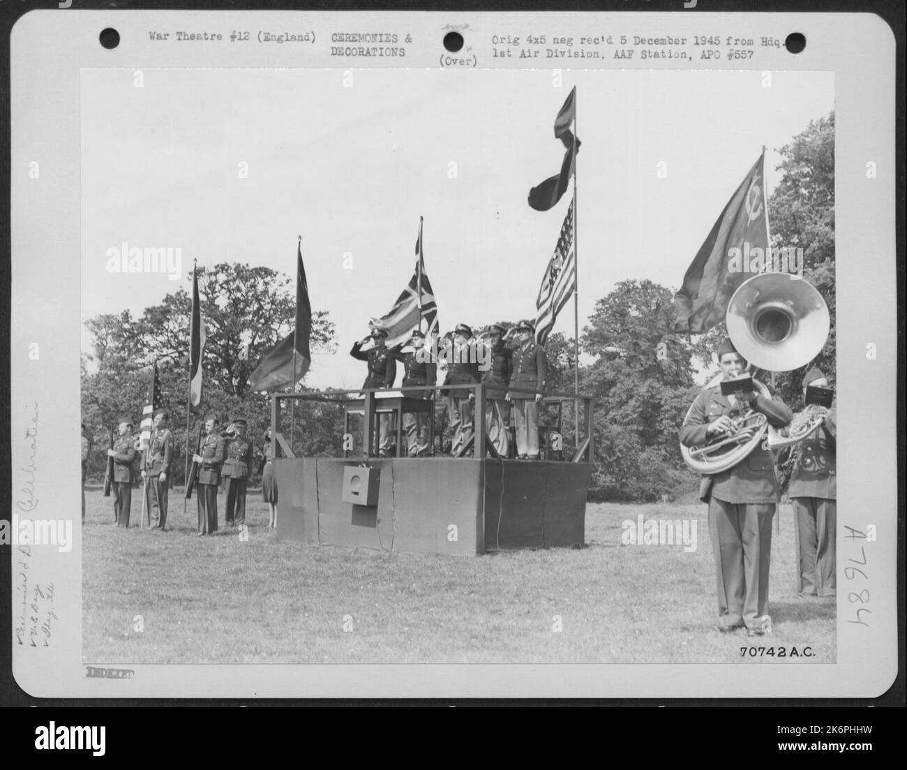 Men Salute As The National Anthem Is Played During A Ceremony