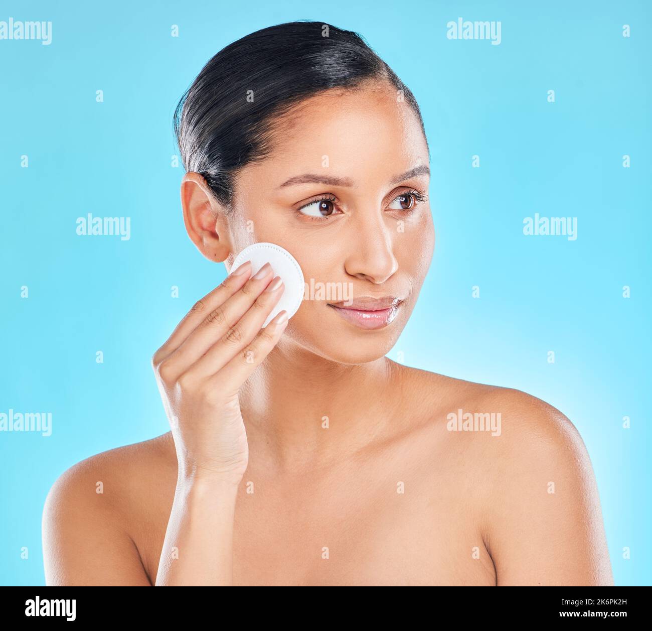 Time to exfoliate. Studio shot of an attractive young woman exfoliating