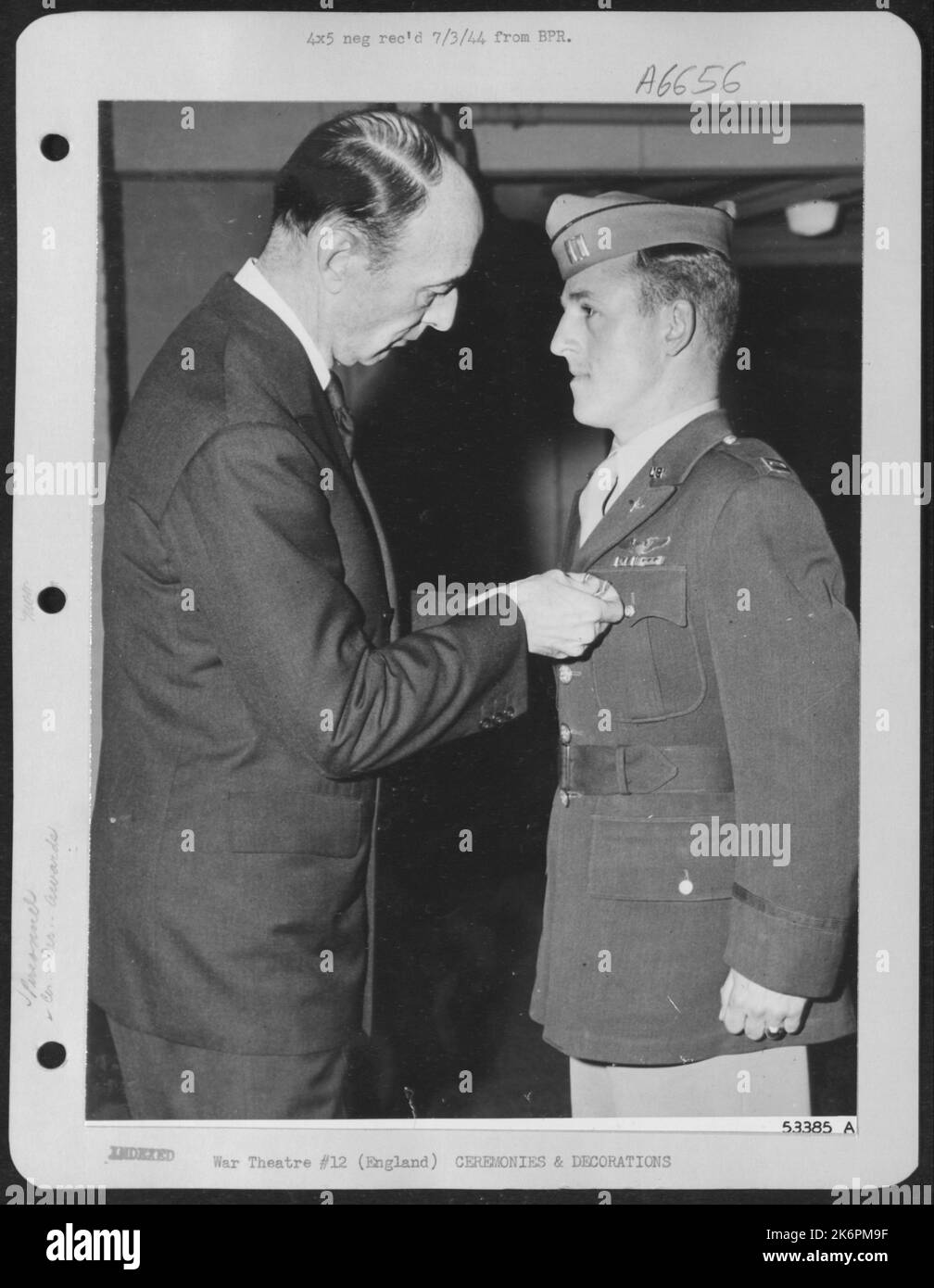 ENGLAND-Capt. Robert J. Rankin, of 1505 S. Street Southeast, Washington, D.C., is awarded the Distinguished Service Cross by Mr. R.M. Lovett, Asst. Sec. of War for Air. Stock Photo