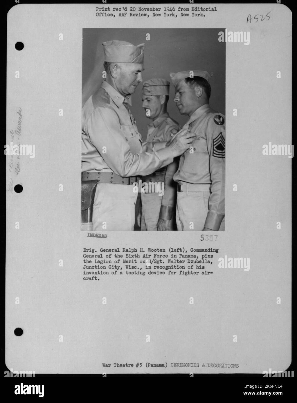 Brig. General Ralph H. Wooten (Left), Commanding General Of The Sixth Air Force In Panama, Pins The Legion Of Merit On M/Sgt. Walter Dzubella, Junction City, Wisc., In Recognition Of His Invention Of A Testing Device For Fighter Aircraft. Stock Photo