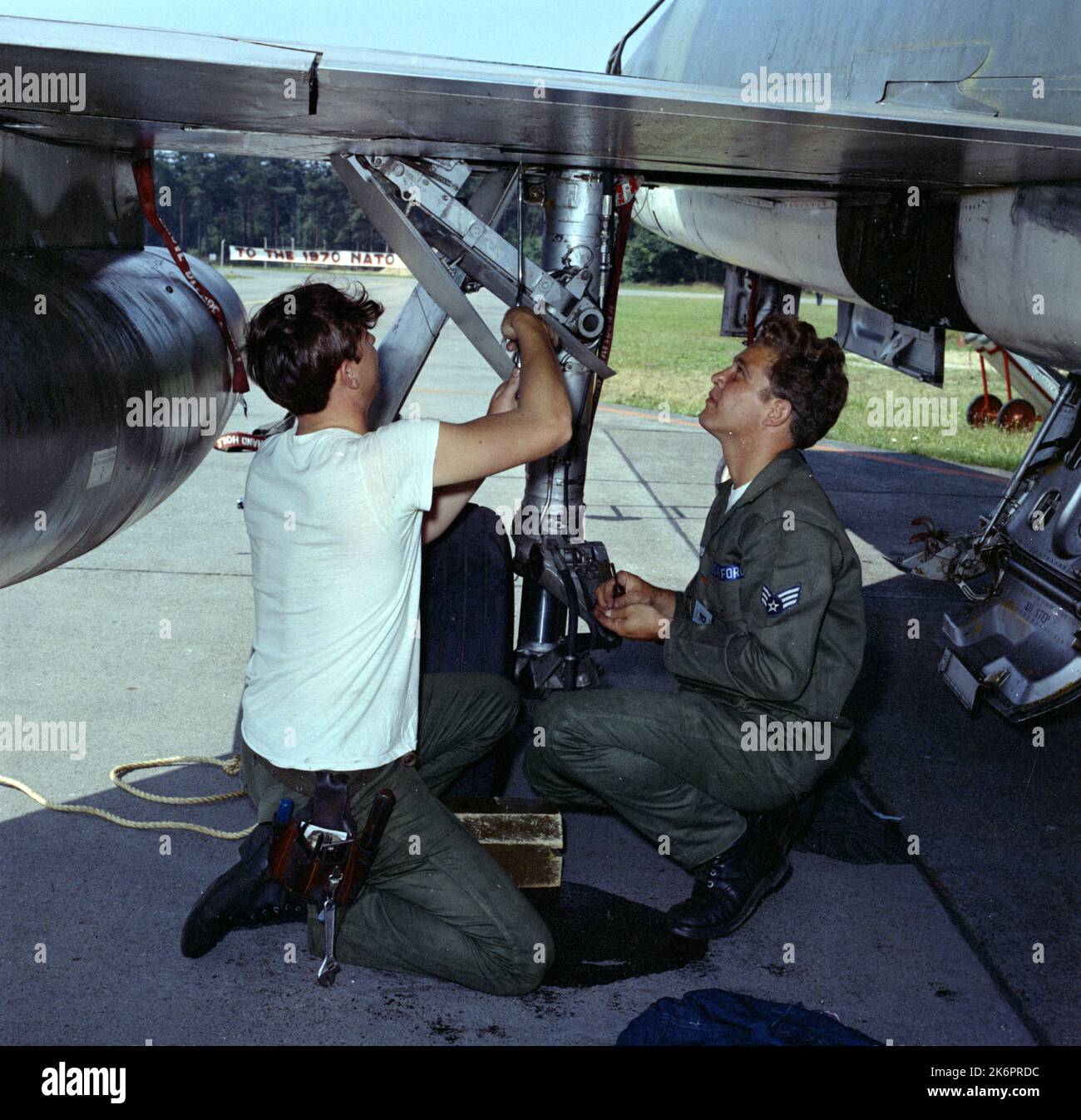 Maintenance Men Repair a Leak on an F100 Hydraulic Landing Gear System