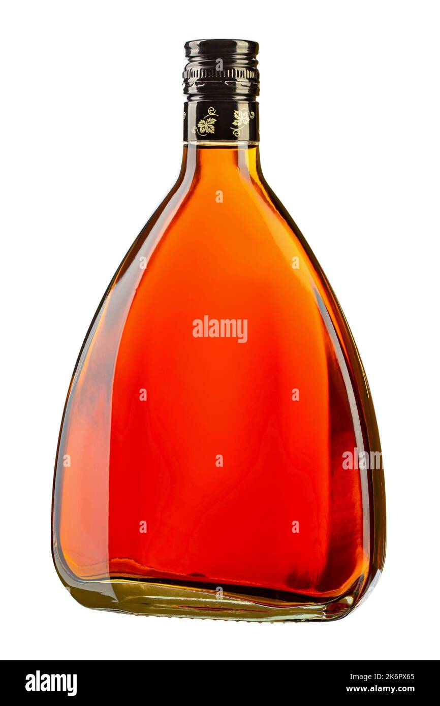 Bottle of amber color premium alcohol, isolated on white background. Ideal for mock-up of whisky, brandy, cognac or rum design. File contains clipping Stock Photo