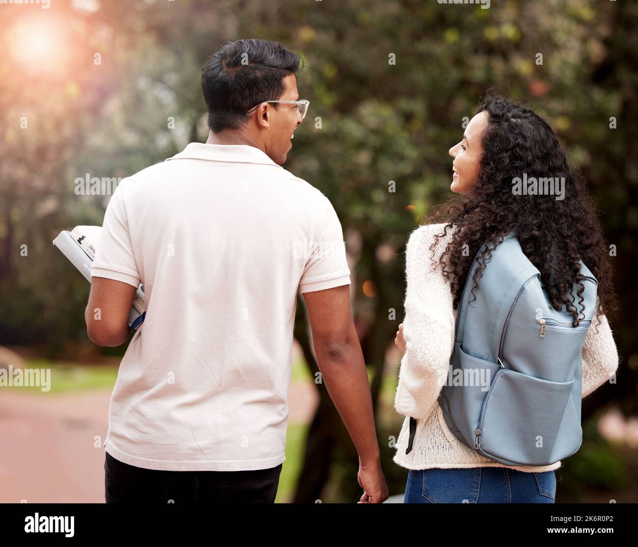 Walking towards a better future. two young college students at college. Stock Photo