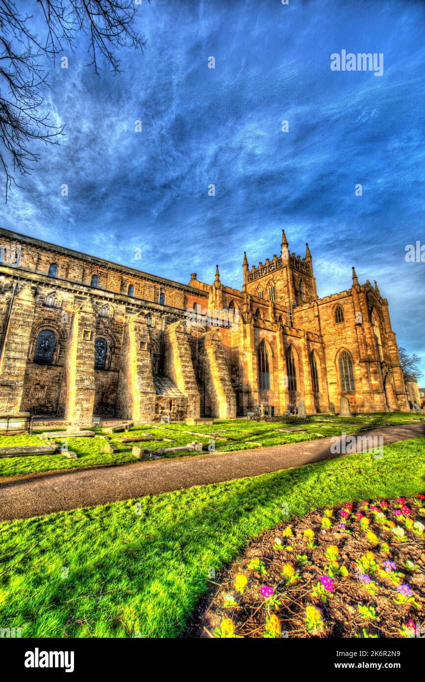 City of Dunfermline, Scotland. Artistic view of the southern façade of Dunfermline Abbey, with a flowerbed in the foreground. Stock Photo