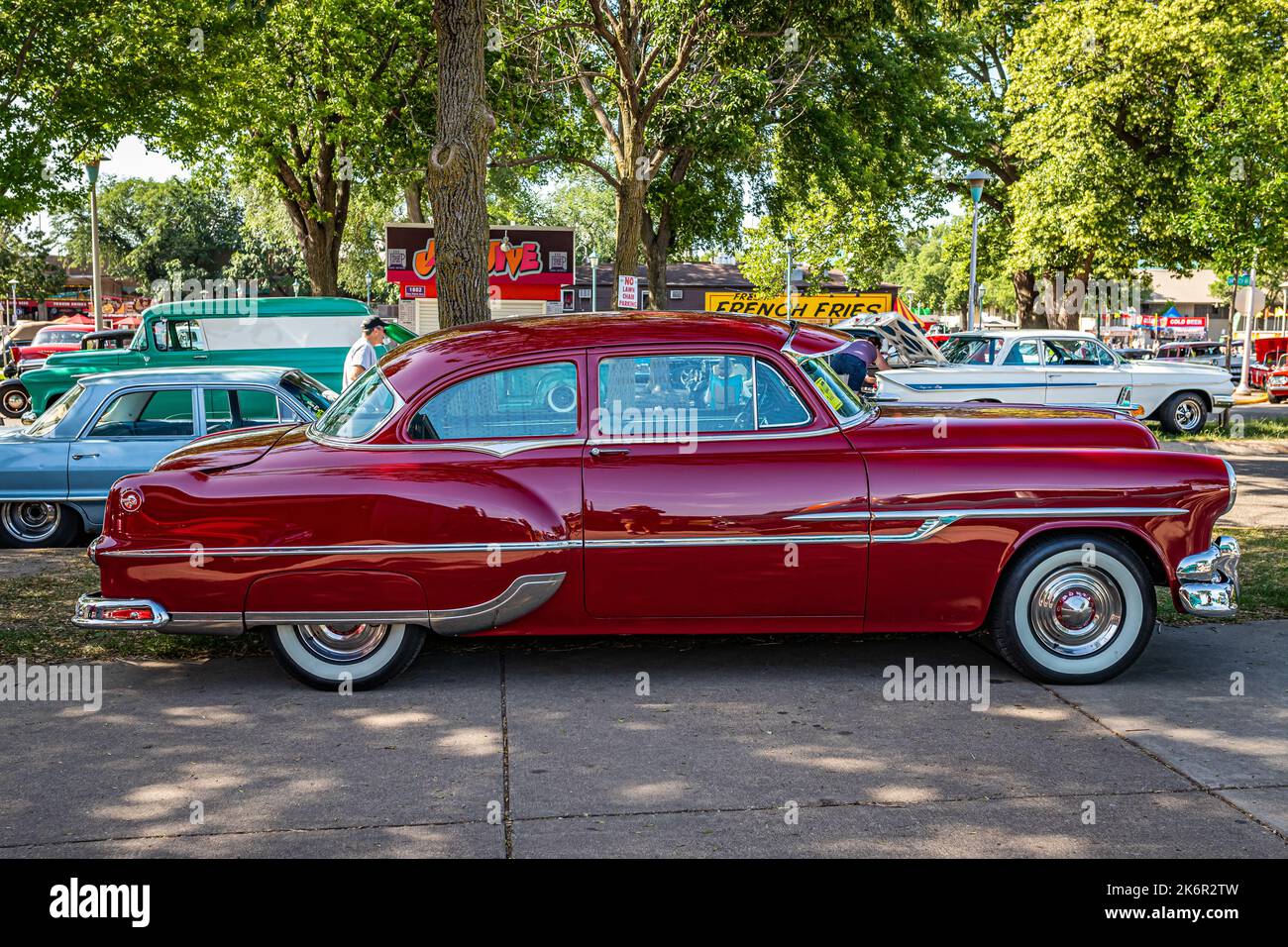 Falcon Heights, MN - June 19, 2022: High perspective side view of a 1953 Pontiac Chieftain 2 Door Sedan at a local car show. Stock Photo