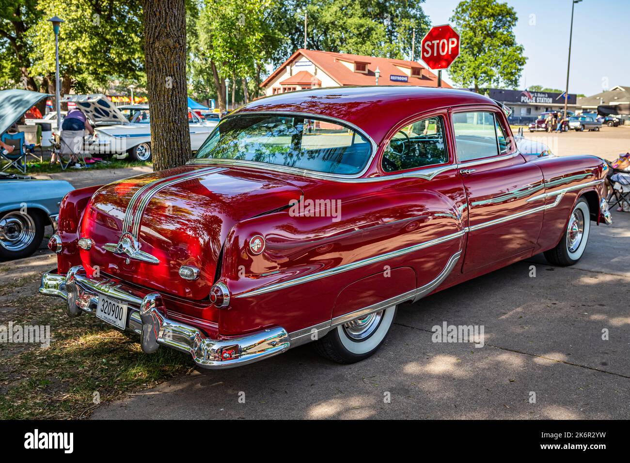 Falcon Heights, MN - June 19, 2022: High perspective rear corner view of a 1953 Pontiac Chieftain 2 Door Sedan at a local car show. Stock Photo