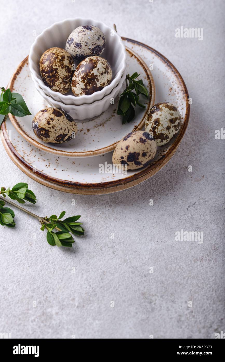Bowl with quail eggs on light background Stock Photo