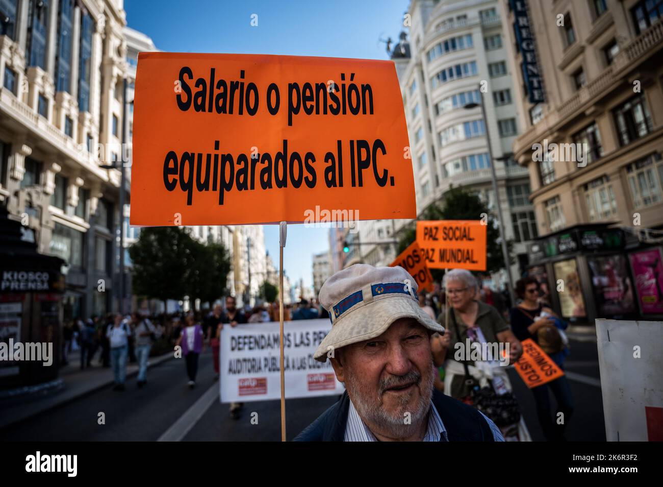 Madrid, Spain. 15th Oct, 2022. A man carrying a placard with the words 'salary or pension equal to the CPI' protesting during a demonstration where thousands of pensioner from all over Spain have taken the streets to demand a 'real CPI (Consumer Price Index) in salaries and pensions'. Pensioners are demanding that the minimum pensions correspond to 60% of the minimum wage. Pensioners, Unions and citizens have demonstrated through the city center shouting slogans against government, threatening with a general strike, and demanding the non privatization of public services. Stock Photo