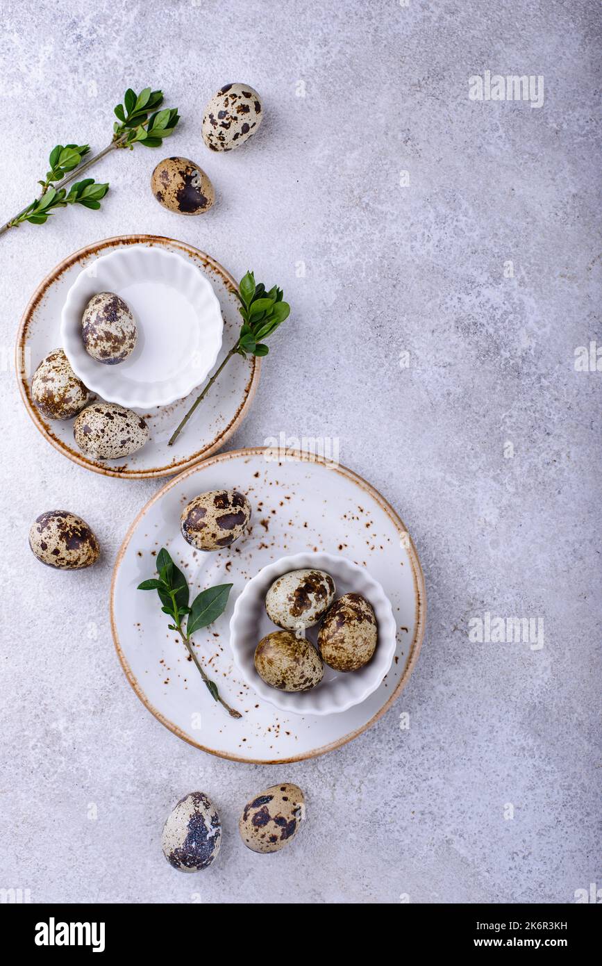 Bowl with quail eggs on light background Stock Photo