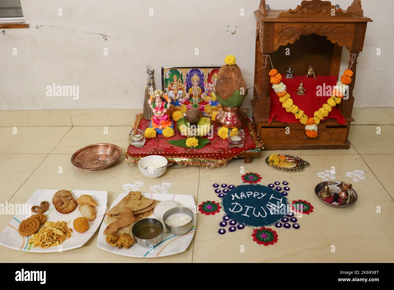 traditional setup of diwali pooja of laxmi, sarswati and ganesh on occassion of laxmi poojan or dhan teras Stock Photo