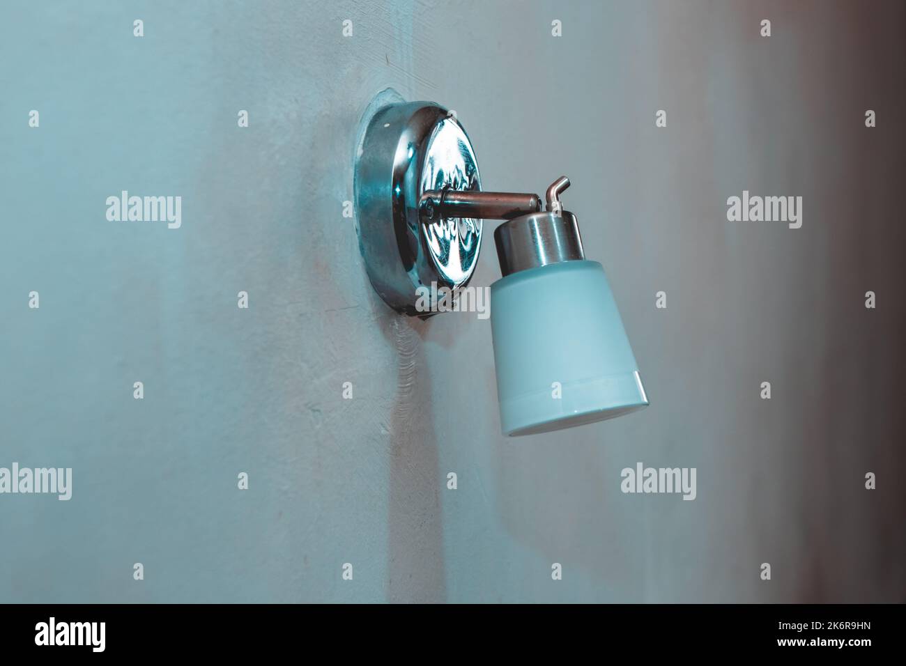 Turning off the lamp on the wall, the concept of the crisis of