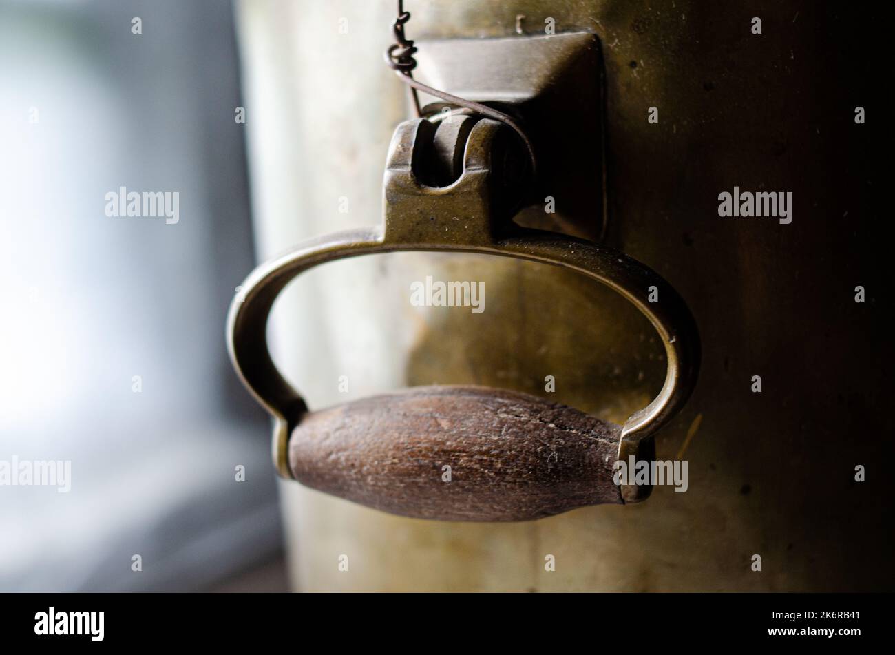 handle and faucet from a samovar Traditional  samovar on light blue background. Space for text Stock Photo