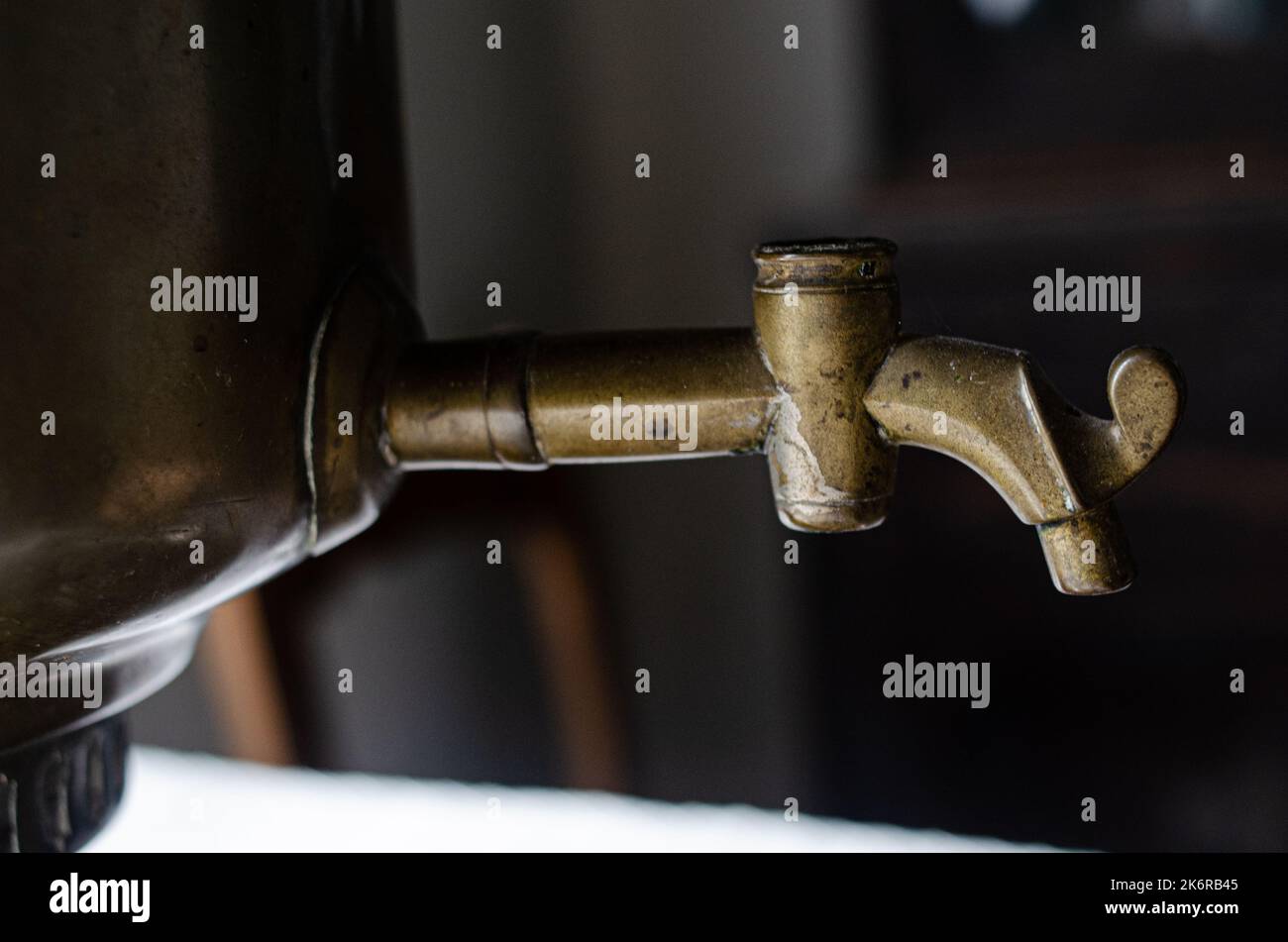 handle and faucet from a samovar Traditional  samovar on light blue background. Space for text Stock Photo