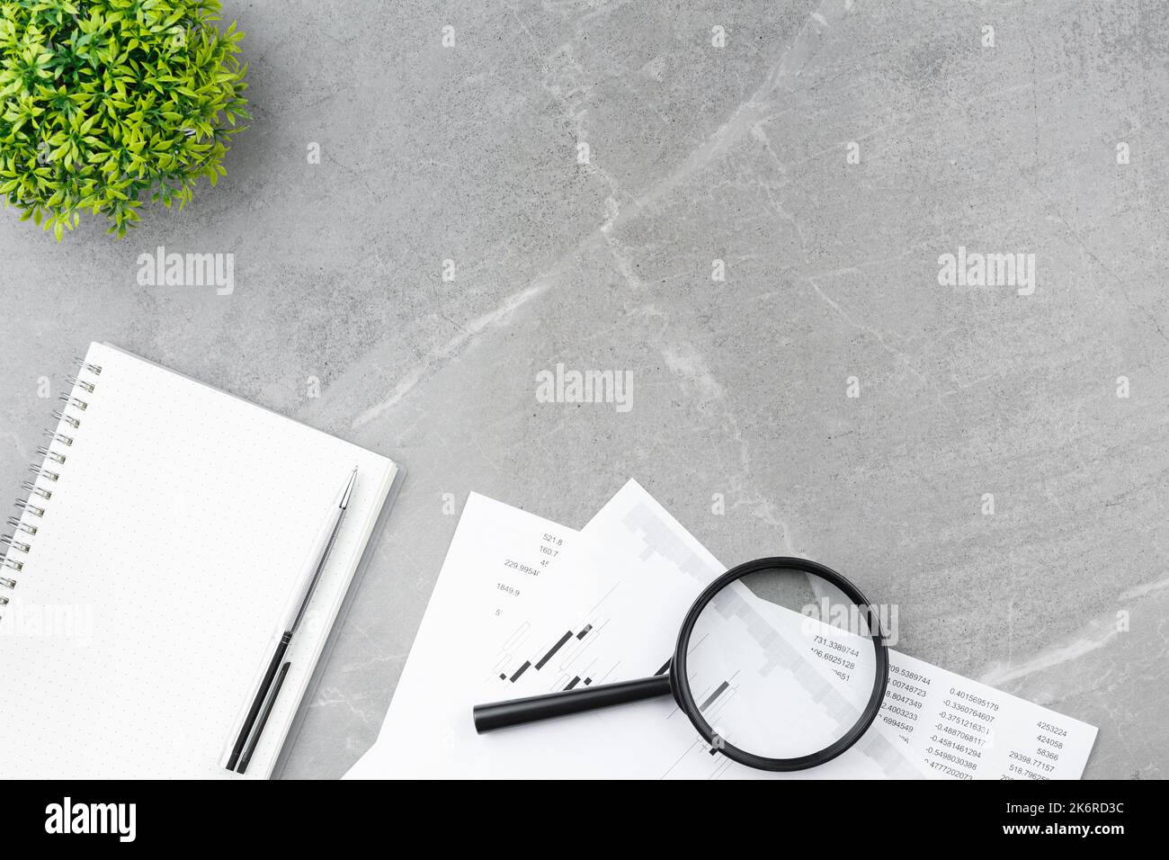 Open notepad on gray marble background Stock Photo
