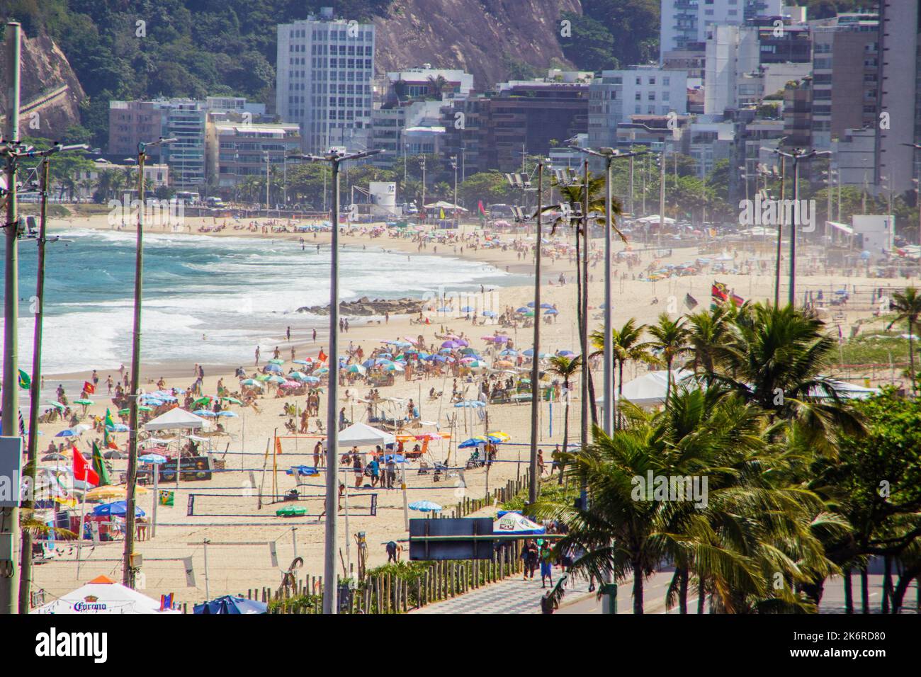 Ipanema beach in Rio de Janeiro, Brazil - October 25, 2022: Ipanema beach full in a beautiful sunny day in Rio de Janeiro. Stock Photo