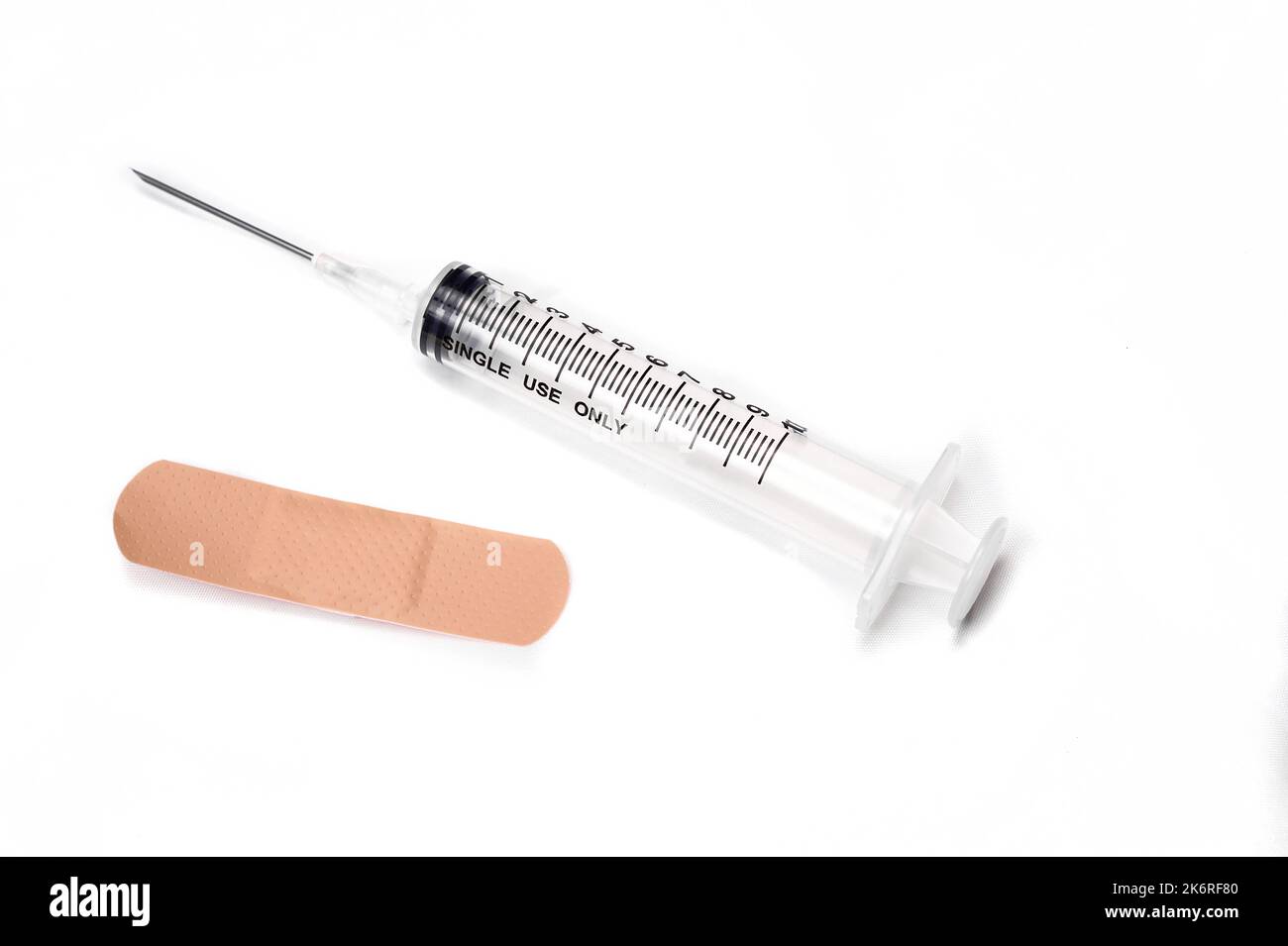 Medical syringe and an adhesive sanitary dressing Stock Photo Alamy