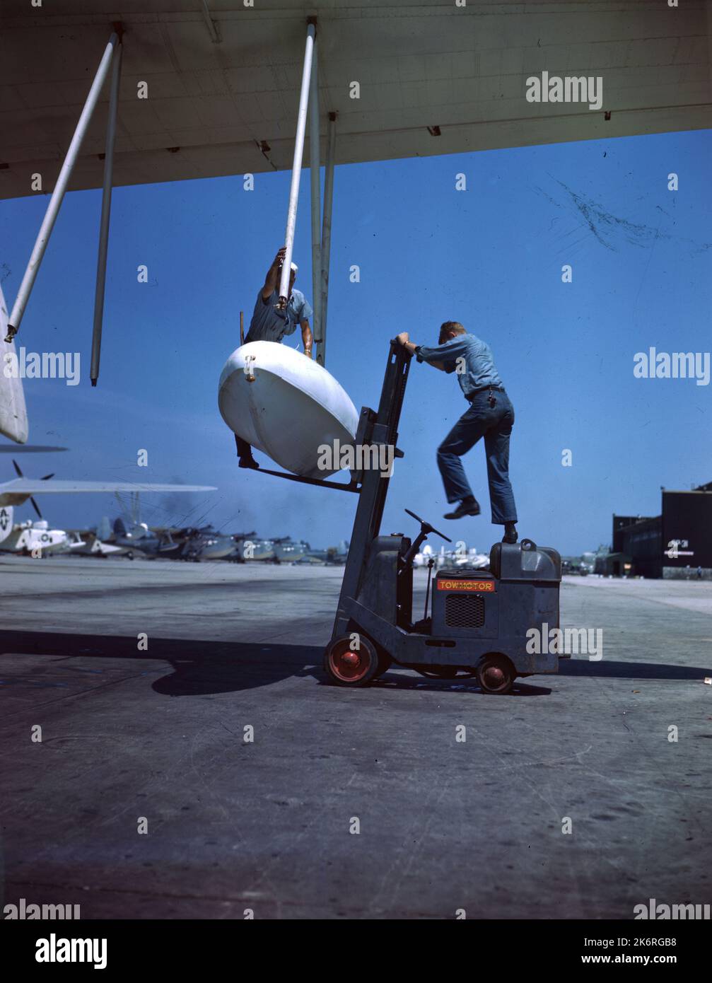 "PBM Mariner at NAS Norfolk, CA. Fork lift truck at work lifting new