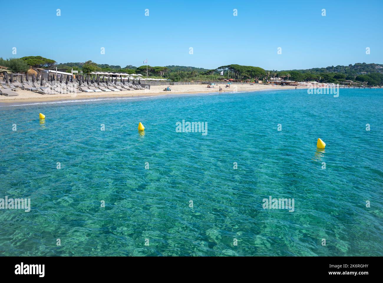 Crystal clear blue water of  legendary Pampelonne beach near Saint-Tropez, summer vacation on white sandy beach of French Riviera, France Stock Photo