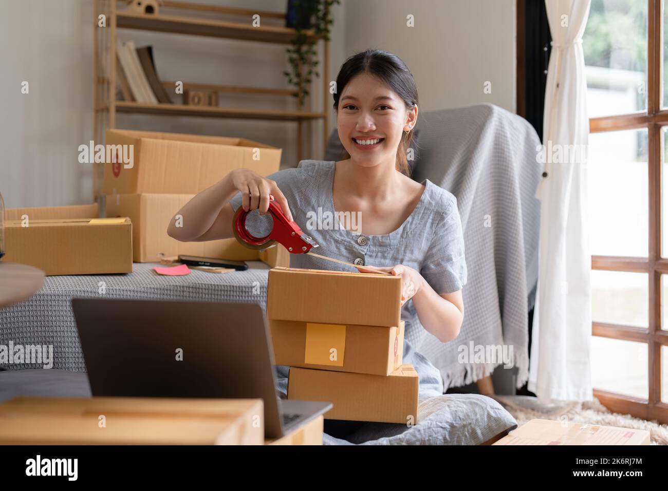 Asian small business owner working at home office. Business retail market and online sell marketing delivery, SME e-commerce concept Stock Photo